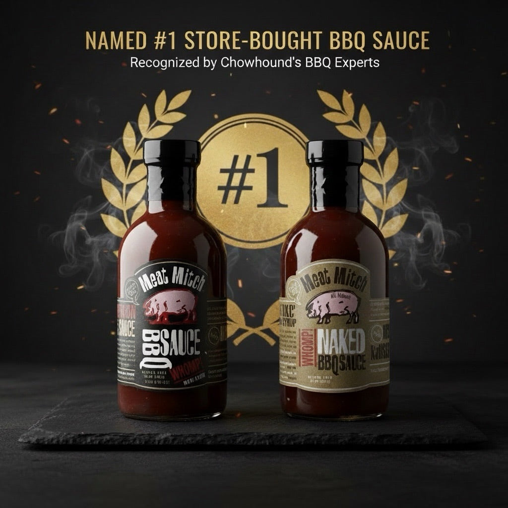 Two bottles of Meat Mitch Naked BBQ Sauce displayed side by side on a dark slate platter, with a gold circular '#1' emblem and laurel wreath behind them. Text at the top reads 'NAMED #1 STORE-BOUGHT BBQ SAUCE' and 'Recognized by Chowhound's BBQ Experts'. - View larger image 2 of 2